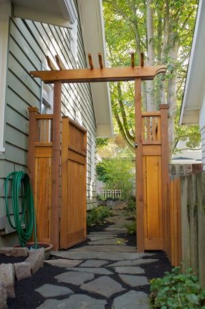 Landscape makeover: Planning and collaboration turn muddy yard into attractive hardscape | OregonLive.com Rock Walkway, Backyard Gates, Garden Gates And Fencing, Garden Gate Design, Wooden Gate, Garden Door, Side Yards, Front Yard Fence, Stone Walkway