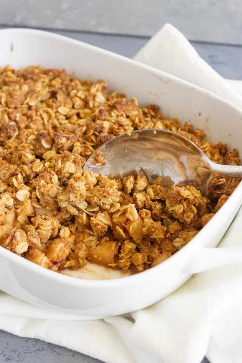 If you are looking for a healthy low sugar apple dessert then this low sugar apple crisp is calling your name. The crumble topping with oats is baked over perfectly spiced apples. It is divine served warm with vanilla ice cream. Apple Crisp Low Sugar, Low Sugar Apple Crisp, Low Sugar Apple Crisp Recipe, Low Calorie Apple Desserts, Low Carb Apple Crisp With Oats, Apple Crisp Recipe Single Serving, Apple Crumble Recipe Single Serving, 10 Minute Single Serving Apple Crisp, Applecrisp Crumble No Oats