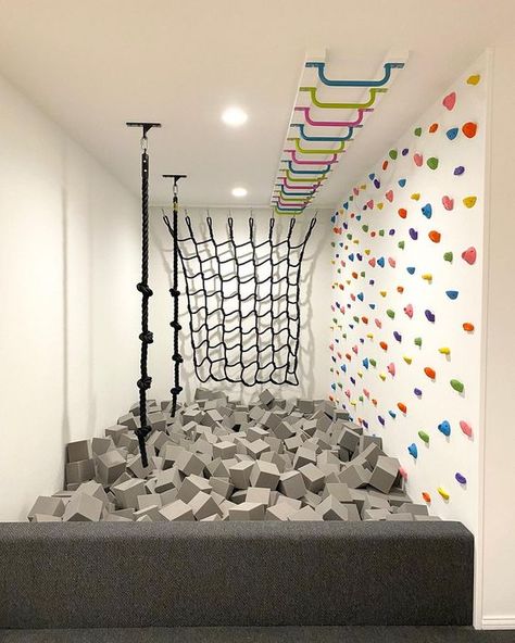 Playroom With Foam Pit, Fun Home Interior, Playground In Basement, Rockwall In Playroom, Indoor Playroom Design, Indoor Foam Pit, Fun Ceiling Design, Playroom Foam Pit, Basement Activity Room