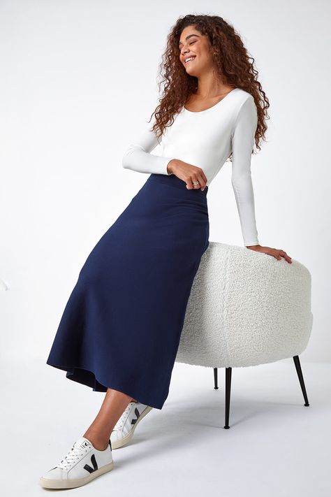 Plain Knitted Midi Skirt by Roman Originals UK Keep it classic with this elegant knitted midi skirt Its Aline shape and elasticated waistband ensures that its comfortable for everyday wear whilst its midi length gives you a flattering modest chic look Complete your ensemble with boots a classy top for a look that takes you from desk to dinner with minimum effort and maximum style Womens Regular fit True to size 70 Polyester 30 Polyamide Machine Washable Length Approx 80cm Warm Knitted Fabric Navy Blue Long Skirt Outfit, Navy Midi Skirt Outfit, Knitted Midi Skirt, Modest Chic, Navy Midi Skirt, A Line Midi Skirt, Midi Skirt Outfit, Knit Maxi Skirt, Faux Leather Biker Jacket