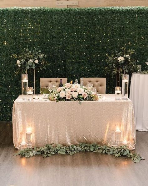 A greenery wall with lights and some greenery decor of the tables and stands look cool and fresh / Modern Neutrals Brides Table, Bride Groom Table, Sweetheart Table Decor, Head Table Decor, Rustic Wedding Decorations, Head Table Wedding, Wedding Reception Backdrop, Sweetheart Table Wedding, Greenery Decor