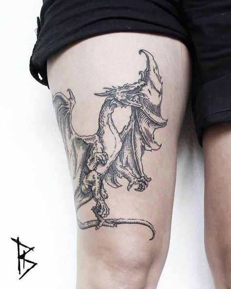 Medieval dragon tattoo on the thigh - Tattoogrid.net Dragon Tattoo Forearm, Japanese Skull, Dragon Thigh Tattoo, Dragon Medieval, Half Sleeve Tattoos Forearm, Dragons Tattoo, Dragon Tattoos For Men, Woodcut Tattoo, Medieval Tattoo