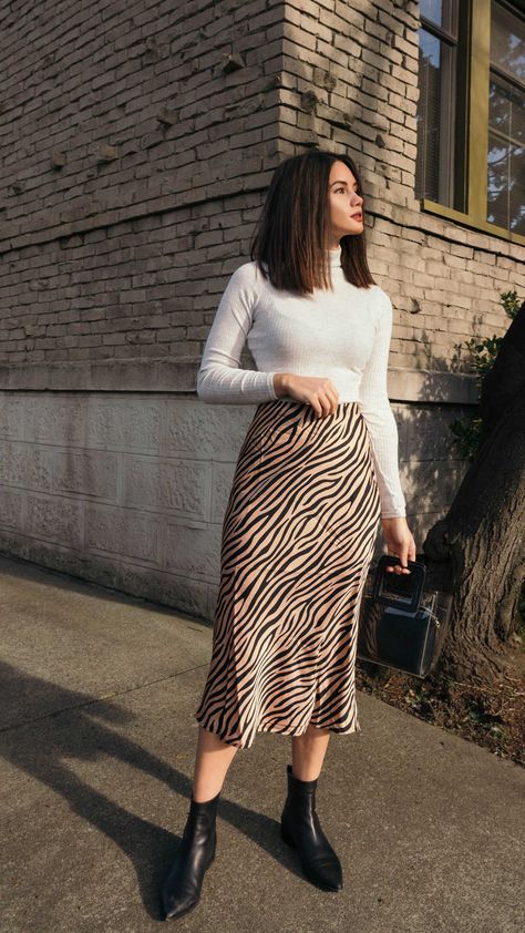 Tiger Print Midi Skirt. Click to shop this outfit. Work Outfits Women Midi Skirt, Skirts And Long Sleeves Outfits, H&m Skirts Outfit, Long Skirt Outfits For Office, Skirt And Top Styling, Skirts Autumn Outfit, Skirt Outfits Ideas Casual, Winter Outfits Skirt Midi, Midi Skirt For Fall