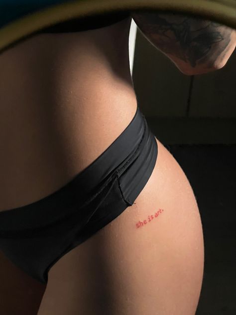 Cute Red Ink Tattoos, Red Ink Hip Tattoo, She Is Tattoo, Small Breast Tattoo, She Is Art Tattoo Ideas, Spicy Tattoo Ideas, Red Word Tattoo, Tattoo Ideas Red Ink, Underboob Tattoos Words