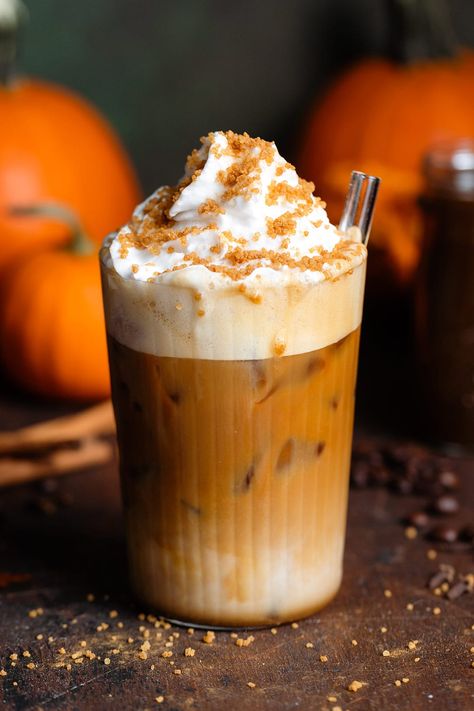 This Starbucks Copycat Iced Pumpkin Spiced Latte is the perfect fall drink! It's made with homemade pumpkin syrup and you can make it both iced or hot. The drink is topped with whipped cream and crunchy pumpkin spice topping. This drink is just as tasty as Starbucks, healthier, and cheaper! Vegan Starbucks, Iced Pumpkin Spice Latte, Pumpkin Spiced Latte, Smoothies Healthy, Pumpkin Syrup, Spiced Drinks, Fall Drink, Pumpkin Sauce, Pumpkin Pie Mix