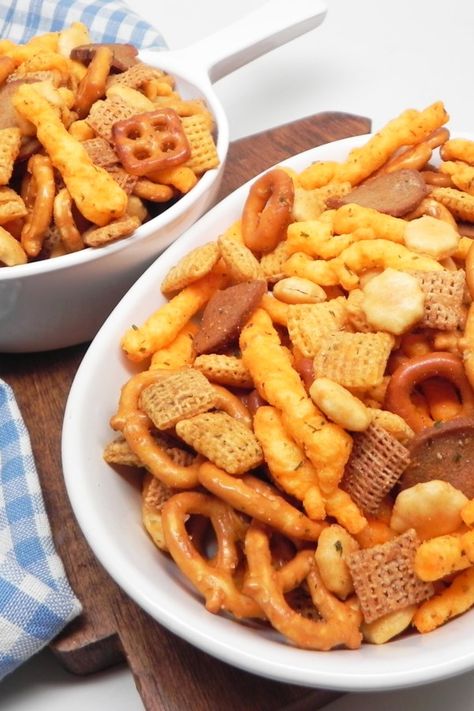 No-Bake Snack Mix | "This is my mom's no-bake snack mix recipe, and it's so much better than the normal snack mix recipes out there. It's tangy, spicy, and insanely addicting!" #footballrecipes #gamedayrecipes #tailgatingrecipes #superbowlrecipes #superbowlparty #superbowlpartyideas Snack Mix No Bake, Easy Chex Mix Recipes No Bake, No Bake Snack Mix Recipes, Easy Snack Mix Recipes No Bake, No Bake Chex Mix Recipes, Toddler Snack Mix Ideas, Cracker Mix Recipes, Cheesy Snack Mix, Ranch Chex Mix Recipes