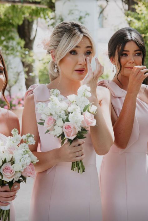 Bridesmaids wearing pale pink one shoulder dresses with bow at shoulder for an Italian outdoor wedding Bridesmaid Dresses With Bows On Shoulder, Pink Bridesmaid Dresses With Bow, Bridesmaid Hairstyles With Off Shoulder Dress, Peony Pink Bridesmaid Dresses, Pink Bow Wedding, Pink Bridesmaid Dress With Bow, Bow Bridesmaid Dress, One Shoulder Gowns, Pastel Pink Bridesmaid