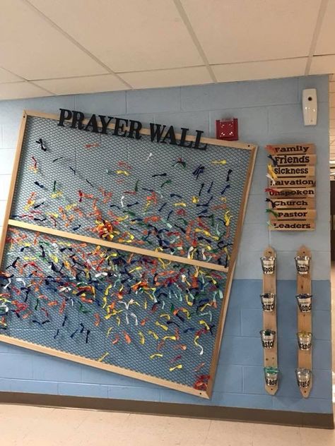 Use a space on your walls to put up a prayer wall like this. Using fabric scraps, tissue paper, or anything lightweight and flexible and give each color a topic of prayer request. Encourage the youth to go each service and pray over some of the colors, maybe even recruit a few who want a way to serve to go and pray over them and help reset the board every couple weeks. High School Ministry Room, Kids Prayer Wall, Verse Of The Week Board Diy, Prayer Wall For Kids, Youth Decorations Church, Youth Art Projects, Answered Prayers Board, Christian Prayer Room Design Ideas, Church Youth Group Room Design