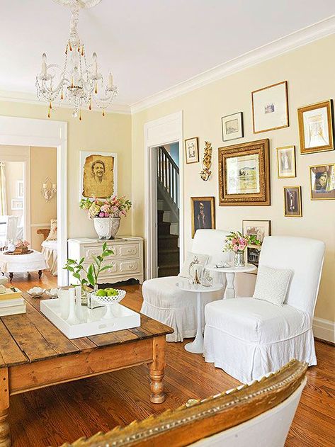 Antique Color Scheme  Tea-Stain + Gold + White. Love the wooden floors and antique gallery wall Pale Yellow Walls, Light Yellow Walls, Yellow Walls Living Room, White Slipcovers, Yellow Paint Colors, Yellow Colour Scheme, Yellow Room, Yellow Living Room, Yellow Interior