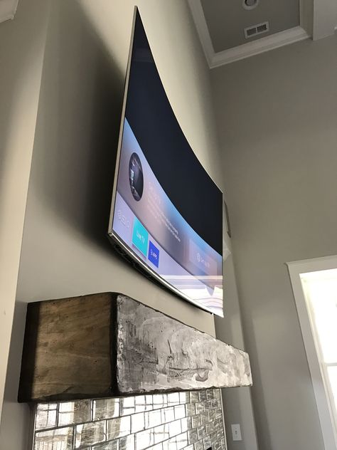 65 inch curved tv above fireplace. Curved Tv Wall, Wall Mounted Tv Decor, Curved Tv Stand, Apartment Tv, Tv On The Wall, Tv Image, Tv Over Fireplace, Tv Mounted, Tv 65