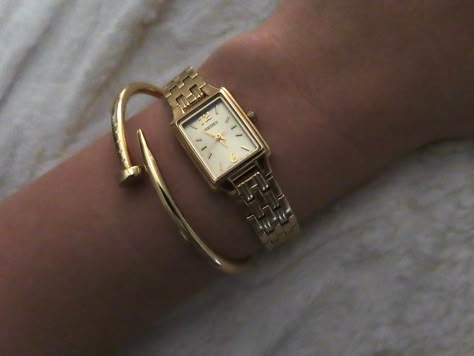 Dainty gold watch, rectangle watch, gold seiko watch, gold watch, gold jewelery, cartier nail bracelet, nail bracelet, gold nail bracelet, gold stack, gold watch and bracelet, watch aesthetic Gold Watches Women Rectangle, Cartier Rectangle Watch, Dainty Square Watch, Gold Square Watches Women, Women’s Rectangle Watch, Seiko Essentials Watch, Delicate Gold Watch Women, Cartier Bracelet Nail, Golden Watch Aesthetic