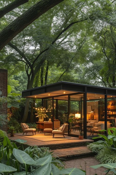 A stylish office set in a garden pavilion structure, with mid-century modern furniture surrounded by lush landscaping, offering an inspiring and refreshing environment for creative pursuits. Garden Studio Ideas, Mid Century Modern Cabin, Garden Gazebo Ideas, Pavilion Structure, Taman Ujung, Mid Century Modern Backyard, Garden Office Ideas, Mid Century Modern Homes, Garden At Home