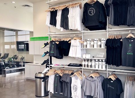 Modern Retail Display Fixtures & Sign Displays - UDIZINE Retail Wall Display Ideas Clothing, Fitness Studio Retail Display, Sweatshirt Display Retail, Retail Apparel Display Ideas, Retail Display Fixtures, Retail Display Clothing, Yoga Merchandise Display, Merch Wall Display, Yoga Studio Retail Display