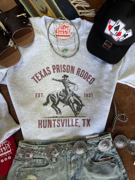 Channel the spirit of the Wild West with the Texas Prison Rodeo Graphic Sweatshirt. Featuring a bold, vintage-style design that honors the iconic rodeo event, this cozy sweatshirt brings rugged charm to your casual wardrobe. Perfect for layering on cool days, it offers warmth and comfort with a nod to authentic cowboy history. Whether you're relaxing or on the go, this sweatshirt lets you wear a piece of Texas rodeo legacy in style. Made in the USA Cute Southern Outfits, Cowboy History, Texas Rodeo, Texas Prison, Nfr Outfits, Rodeo Events, Southern Outfits, Western Boutique, Cute Country Outfits