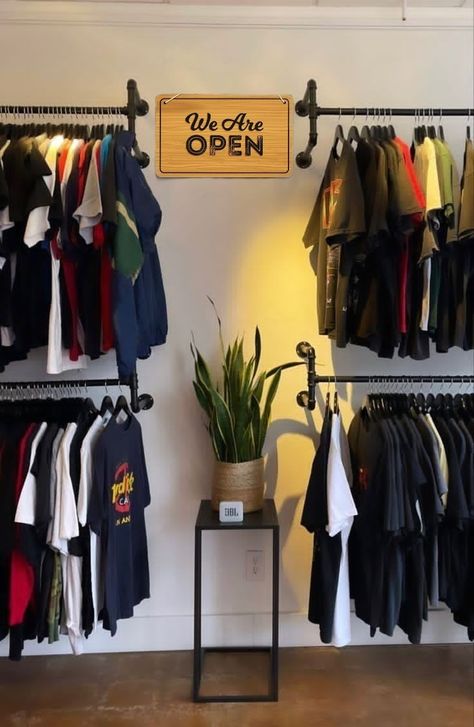 Men’s Clothing Store Interior, Clothes Shelves Ideas, Men’s Small Apartment Ideas, Hanger Design Ideas Hanging Clothes, Exposed Closet Ideas Open Wardrobe, Tshirt Hanging Ideas, Industrial Clothing Store, Display Ideas For Clothes, Exposed Closet Bedroom