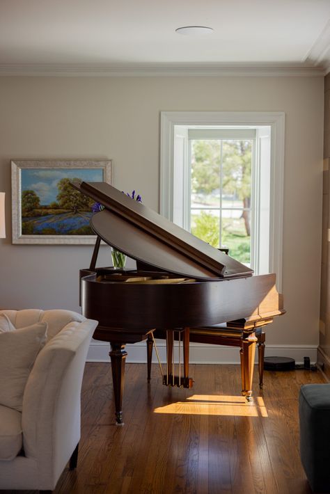 A baby grand piano is such an elegant piece to display in your living room.  1930s home renovation in Tulsa OK by Kirkendall Design #kirkendalldesign #tulsadesign #luxurydesign #interiordesign #babygrandpiano Piano In Modern Living Room, Home Piano Studio, Grand Piano Living Room Layout, Baby Grand Piano In Small Space, Piano Corner Living Room, Baby Grand Piano In Living Room, Grand Piano In Living Room, Small Piano Room, Piano In Living Room