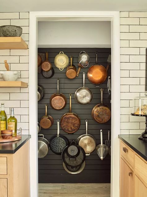 10 Ways to Organize Pots and Pans When Your Cabinet Space Is Limited Organize Pots And Pans, Cookware Display, Kitchen Wall Organizer, Cookware Storage, Pan Storage, Hanging Pans, Mediterranean Kitchen, Pot Storage, Pot Rack Hanging