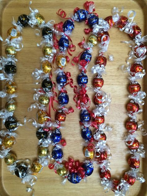 Lindt Candy Lei Candy Lei Diy, Diy Lei, Graduation Candy Lei, Grad Leis, Candy Leis, Lei Graduation, Graduation Leis Diy, Starburst Candy, Graduation Money Lei