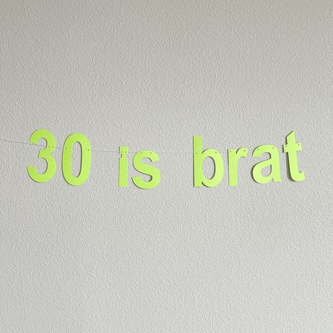 Turning 30 and ready to embrace your inner brat? 🎉 Make a statement with a sassy '30 is Brat' banner! Perfect for celebrating the big 3-0 with bold attitude and style. Whether you're planning a party or just want to flaunt your fierce side, this banner is the ultimate addition to your milestone celebration. After all, 30 is all about owning it and having fun! 💁‍♀️✨ #30IsBrat #MilestoneBirthday #SassyAnd30 #BirthdayDecor Beige Banner, 30th Birthday Banner, 30th Birthday Decorations, Turning 30, Banner Birthday, Custom Banner, Cotton String, Custom Banners, Milestone Birthdays