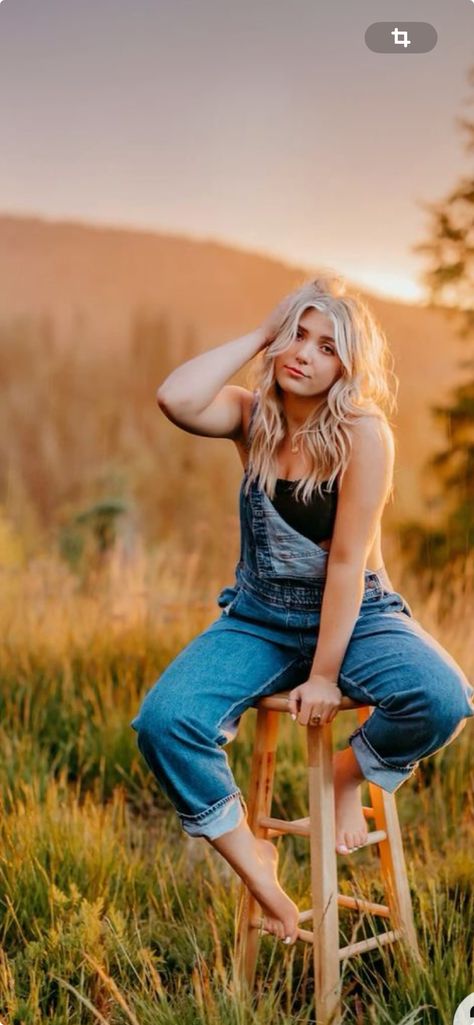 Senior Pictures With Overalls, Field Chair Photoshoot, Stool Picture Poses, Senior Picture Ideas Stool, Senior Picture Chair Poses, Non Traditional Senior Picture Ideas, Stool In Field Photoshoot, Senior Field Photos, Senior Photos In Field