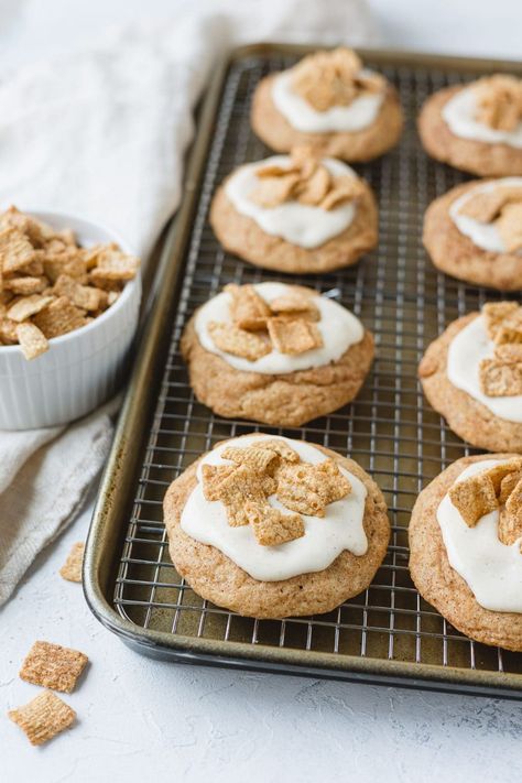 This Crumbl copycat recipe is a soft and chewy cinnamon cookie with a swirl of cream cheese frosting (think cinnamon roll) and topped with a crunchy sprinkle of Cinnamon Toast Crunch cereal. I make these a little smaller than the original for everyday munching. The cinnamon cookies are also delicious unfrosted if you want a less indulgent treat! Crumbl Cinnamon Toast Crunch Cookie, Cinnamon Toast Crunch Icing, Cinnamon Toast Crunch Cookies Recipe, Crumbl Cookie Copycat French Toast, Cookie Copycat Recipes, Cinnamon Cookie Recipe, Crumbl Recipes, Cinnamon Toast Crunch Cookies, Crumbl Cookie Copycat