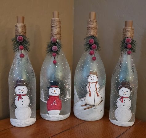 Christmas Wine Bottle Decor, Light Up Wine Bottles Diy Christmas, Snowman Wine Bottle Crafts, Painted Christmas Bottles With Lights, Christmas Light Up Bottles, Winter Wine Bottles, Decorated Wine Bottles Christmas, Glass Bottles Art Christmas, Lighted Wine Bottles Christmas