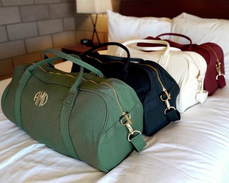 This duffle bag is the perfect gift for you and your girls whether it's going away for a weekend, or spending a week on the road. The cute design of this bag allows you to use it over and over again, even after the wedding has come and gone. It's customizable, handy, and stylish! https://www.etsy.com/shop/GiftsFromHH?ref=simple-shop-header-name&listing_id=1100214142 Satin Bridesmaids Robes, Custom Ring Box, Weekend Bags, Canvas Duffle Bag, Bridesmaid Bags, Wedding Ring Box, Duffle Bags, Sentimental Gifts, Personalized Wedding Gifts