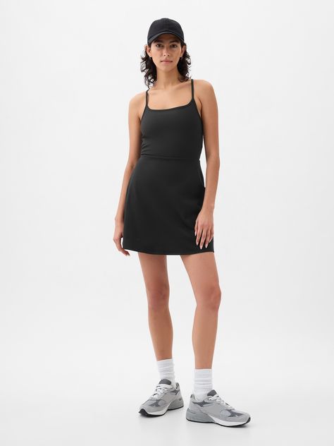 Soft brushed jersey exercise dress.  Moisture Wicking helps keep your skin dry.  Stretch allows freedom of movement while providing superior shape retention.  Square neck.  Adjustable spaghetti straps.  Built-in shorts.  This exercise dress is made with 79% recycled polyester.  Using recycled materials helps to conserve resources and reduce waste.  * Fit: Slim.  A fit & flare silhouette that sits close to the body & flares at the waist.  Hits above the knee.  Models wearing Gap Workout Dress Outfit, Athletic Dress Outfit, Exercise Fits, Capsule Style, Exercise Dress, Work Fits, Athleisure Dress, Mom Fashion, Athletic Dress