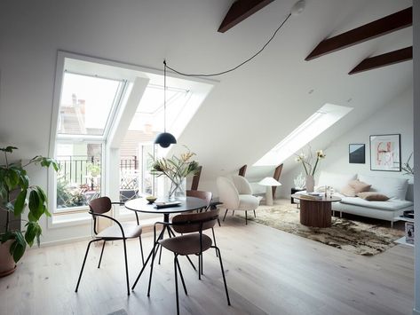 A Scandinavian attic loft of only 34sq. meter looks a lot bigger thanks to the light color scheme ... Attic Studio Apartment, Scandinavian Loft, Glass Room Divider, Attic Loft, Scandinavian Apartment, Attic Apartment, Glass Room, Stylish Apartment, Large Dining Table