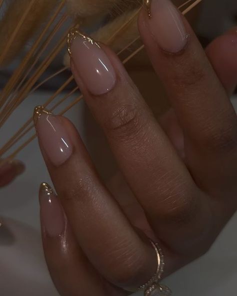 Chicago Nail Artist , danarubylee on Instagram: "One of the best collaborations. Nude, gold, and great nail care.
.
.
.
.
.
#realhotnailshit 
#realhotnailshxt 

#chicagonails #natrualnails #gelnails #nailcare #aesthetic #goldnails #almondnails #almondshapenails 

Chicago nail tech , natural nail care , gel nails , almond nails" Natural Gel X Nails Almond, Gold Design Almond Nails, Gold Nail Tips French, Natural Looking Acrylic Nails Almond, Cute Short Almond Nails Fall, Clean Fall Nails, Hoco Nails Gold, Nude And Gold Nails Short, Champagne French Tip Nails