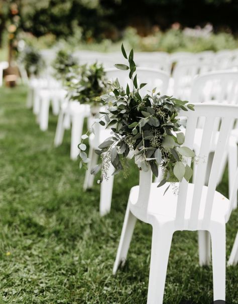 Wedding Plastic Chair Decorations, Plastic Wedding Chairs, Plastic White Chairs Wedding, Plastic Chair Wedding Ceremony, Aisle Garden Wedding, Simple Isle Decorations Wedding Outdoor Ceremony, White Chair Decor, Outdoor Wedding Chairs Ceremony Seating Aisle Decorations, Asile Wedding Ideas Outdoor