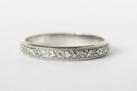 Beautiful 18k white gold engraved wedding band!  This band is wider than the typical engraved band which gives it the space needed for all the details to really show!  The center of the band has intricate flowers with a milgrain border.  There is a small band of plain white gold on either side and it gives the band such an elegant look.  Inside it has the 18k hallmark along with the lion that is Blancard & Co.'s hallmark.  They were a New York jeweler in the early to mid 20th century and made go White Gold Band Ring, Silver Engraved Engagement Ring, White Gold Bands Women, Marriage Ring White Gold, Edwardian Wedding Band, Engraved Wedding Bands For Women, Wedding Bands For Women Platinum, Wedding Bands For Women White Gold, Wedding Bands For Women Silver