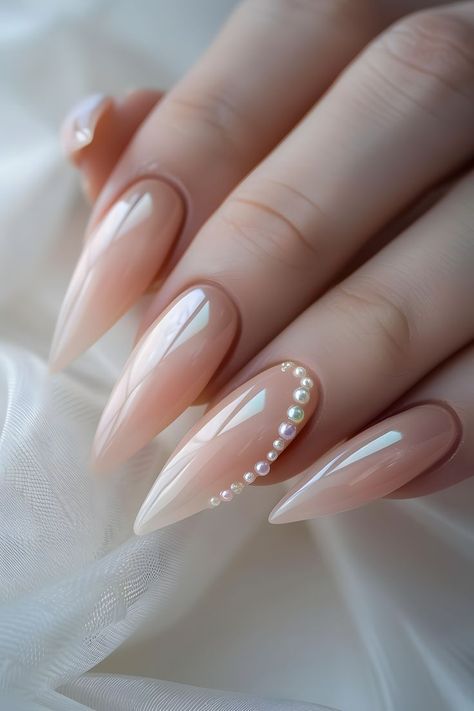 Adorn your nails with pale peach and pearl charms for an elegant look. Follow us for more cool nail art ideas. Visit our blog on the bride’s ultimate guide to perfect wedding nails. Simple Summer Nails | Wedding Day Nails | Nails Design Summer | Elegant Nails | Trendy Nails | Nails With Charms | Nails 2024 Summer | Elegant Touch Nails | Nails Summer 2024 | Nails Elegant Classy | Minimalist Nails | Almond Nails | Nails Easy | Nails Inspo 2024 | Nails Design | Nails Design With Rhinestones Nails With Pearl, Wedding Day Nails, Bridal Nails Designs, Peach Nails, Classy Nail Designs, Summer Nail Art, Pale Peach, Pearl Nails, Wedding Nails Design