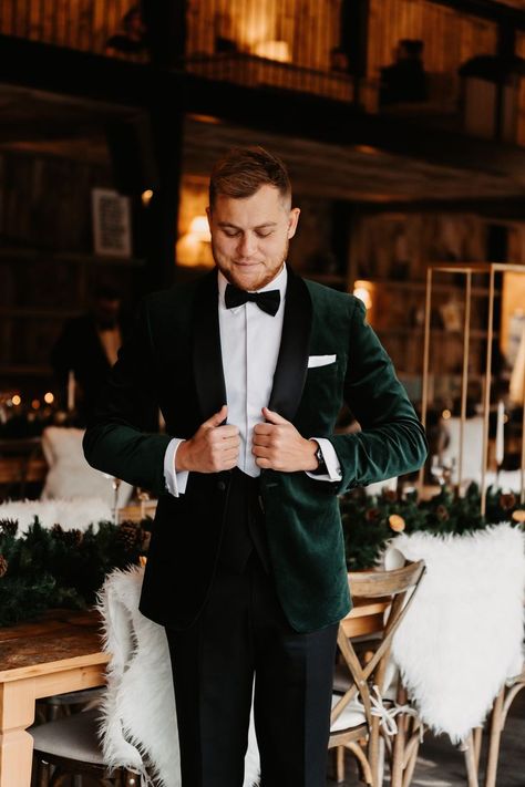 Groom in black tie outfit with velvet green suit jacket for winter wedding in barn venue based in the Lake District Groom Outfit Winter Wedding, Wedding Suits Groom Emerald Green, Velvet Suit Jacket Wedding, Green Suit Jacket Wedding, Men’s Wedding Suits 2023, Emerald Green Tie Black Suit, Forest Green Velvet Suit Men, Green Jacket Groom, Velvet Green Groom Suit