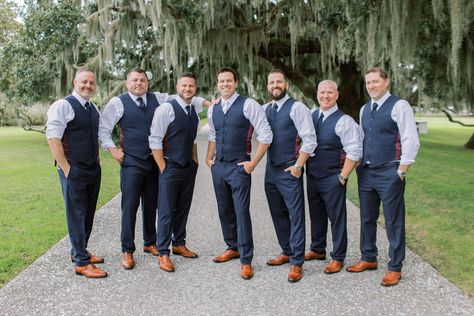 Groom and groomsmen pose for pictures before charming southern wedding. Love their cognac shoes and blue pants and vests! Check out the rest of the wedding at thebridalfinery.com. Blue and tan menswear // mens wedding fashion // groomsmen ideas // groomsmen outfits Groomsmen Just Vests, Vest Only Groomsmen, Groomsmen With Vests Only, Open Collar Groomsmen, Groomsmen Vest And Bowtie, Navy Vest Outfit Mens, Navy Blue Vest Groomsmen, Groomsman Outfit Ideas, Groomsmen Vest Attire