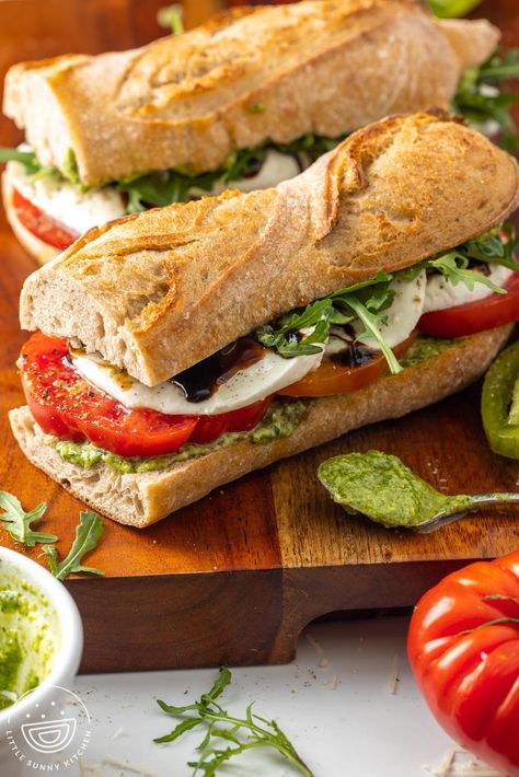 This easy Caprese Sandwich Recipe turns your favorite Italian salad into a hearty sandwich slathered with homemade pesto aioli. Caprese Sandwiches, Panera Caprese Sandwich, Sandwich Recipes With Ciabatta Bread, Picnic Sandwiches Recipes, Chibata Bread Sandwich Easy Recipes, Capers Sandwich, Caprice Sandwich, Caprese Salad Sandwich, Pesto Recipe Sandwich