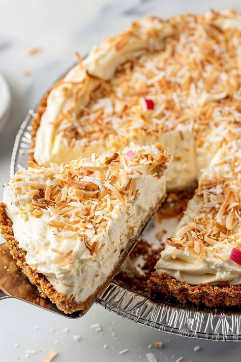 This luscious piña colada cream pie combines the tropical flavors of coconut, pineapple, and rum in a cool and creamy filling. The buttery graham cracker crust provides the perfect crunchy contrast. Coconut Graham Cracker Crust, Tropical Cream Pie, Pina Colada Pie Recipe, Almond Joy Cake, Pineapple Pie, Cream Pies, Coconut Pie, Cracker Crust, Refreshing Desserts