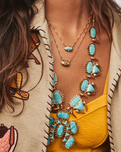 Our icon like you’ve never seen her before. The Elisa Vintage Gold Etch Frame Short Pendant Necklace in Variegated Turquoise Magnesite features our beloved shape surrounded by an etched frame. Inspired by the tooled designs etched on saddles, this pendant is full of Western spirit. This necklace is a part of Yellow Rose by Kendra Scott—a brand that celebrates ranch life with Kendra Scott staples alongside select curated jewelry pieces and accessories. Metal Vintage 23k Yellow Gold Over Brass Mat Western Jewelry Women, How To Wear Turquoise Jewelry, Western Layered Necklaces, Western Bride Jewelry, Gold Western Jewelry, Tourqouis Jewelry, Gold Western Jewellery, Outfits With Turquoise Jewelry, Gold Turquoise Jewelry