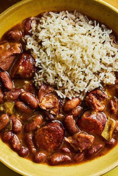 This red Beans and rice recipe from Kwame Onwuachi's book, My America, is his ideal version of the classic Southern dish. It's based on his mom's rendition and starts with the Cajun and Creole trinity of celery, onion, and bell pepper. Red Beans And Rice With Ground Beef, Red Beans And Cornbread, Red Peas And Rice Recipe, Red Beans And Rice Meal Ideas, Sides For Red Beans And Rice, Southern White Beans Recipe, Rice And Red Beans Recipe, Canned Red Beans And Rice Recipe, Southern Style Red Beans And Rice