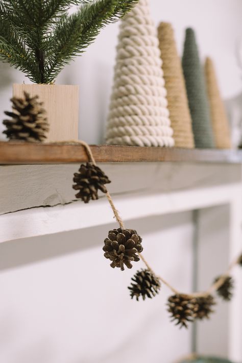 Pinecone Decor Christmas, Yule Pinecone Crafts, Diy Ornaments Pinecone, Gift Wrapping With Pine Cones, How To Make Pinecone Garland, Pinecones Crafts Christmas, Garland With Pinecones, Pine Cone Ideas For Christmas, Fall Decor Pine Cones