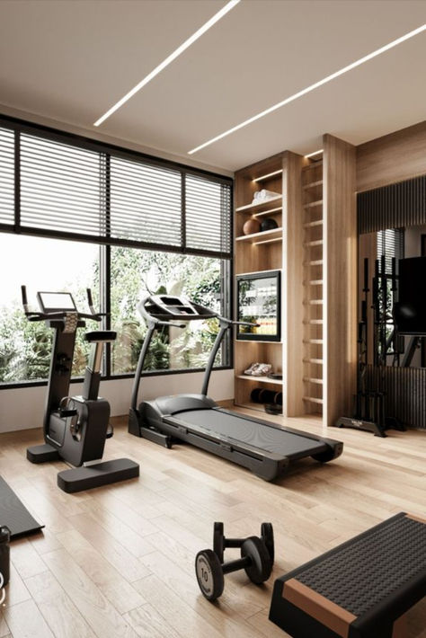 Home gyms don't need to be bleak. Workout equipment that’s been relegated to your basement or tucked into a garage corner can still look really good with the help of a little paint, wallpaper, good lighting, and a few plants, you can totally transform the space you break a sweat in. Home Gym Interior Design Nails Moody Farmhouse Modern Farmhouse Rutic Decor Home Inspo Yoga Trends Yoga Poses Fitness Studio Ideas home wallpaper home decor bedroom home decorating nails home interior design home Fitness Room Ideas Home Gyms House, Gym Rooms In Houses, Home Gym Asethic, Home Gym Studio Ideas, Private Fitness Studio, Home Gym Room Design, Kardashian Gym Room, Luxury Apartment Gym, Luxury At Home Gym