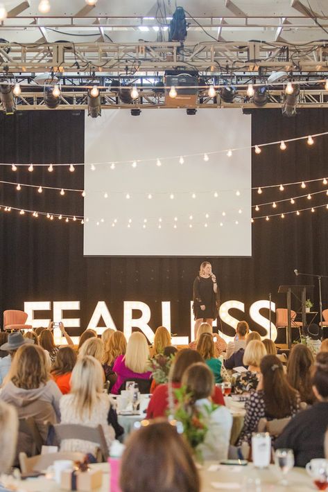 woman speaks on stage with FEARLESS sign behind her | Tennessee Women Connect Live Event at the Loveless Barn photographed by Nashville TN branding photographer Amy Allmand Photography. #AmyAllmandPhotography #TennesseeWomenConnect #NetworkingEvent Women In Leadership Photography, Speak On Stage, Women Events Ideas, Woman On Stage Speaking, Leadership Aesthetic Photography, Women Speaking On Stage, Woman Evolve Conference, Female Speaker On Stage, Speaking Engagement Aesthetic