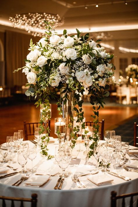 Tall floral centerpiece in terrace room at nybg wedding Tall Table Settings Wedding, Floral Wedding Centerpieces Tall, Tall Calla Lily Centerpiece Wedding, Wedding Flowers Tall Centerpieces, Raised Centerpieces Wedding, High Centerpiece Wedding, Tall Floral Centerpieces Wedding, Nybg Wedding, Wedding Alter Decor