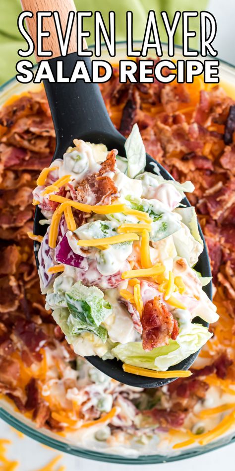 When it comes to potlucks and cookouts, nothing beats a 7 Layer Salad! Make this recipe ahead of time for an easy side dish everyone loves! #BreadBoozeBacon #7layersalad #sevenlayersalad #saladrecipe #potluck #cookout #summer #4thofjuly #fourthofjuly #memorialday #laborday Potluck Seven Layer Salad, 7 Layer Salad No Peas, Healthy Southern Side Dishes, 6 Layer Salad, Cold Veggie Recipes, Salad Recipes Potluck, Best Salad For Potluck, 5 Layer Salad, 5 Layer Salad Recipe