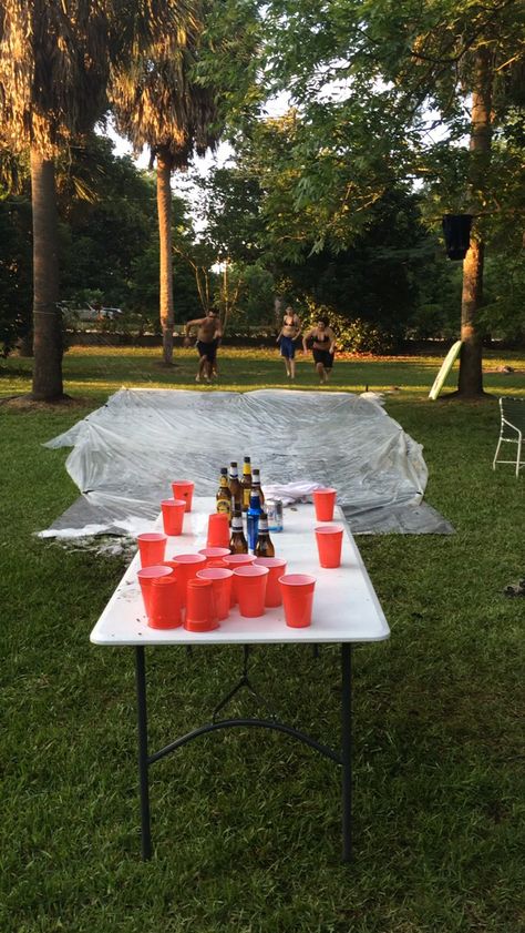 Slip And Slide Flip Cup, Slip And Slide Drinking Game, Adult Water Slide Party, Adult Slip And Slide Party, 4th Of July Games Outdoor Parties, Outdoor Drinking Games For Adults, Slip And Slide Party, Outdoor Party Ideas For Adults Backyards, Party Games For Adults Drinking