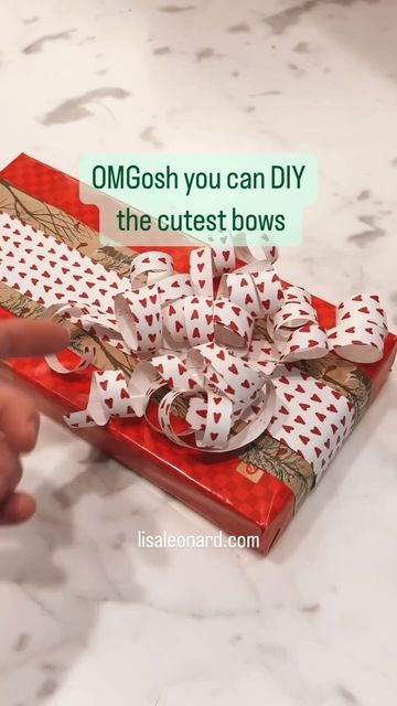 Lisa Leonard on Instagram: "😱 Friends, these bows are so easy and totally adorable! Any wrapping paper will work. Do you LOVE it? Please like and share and let me know if you try it ❤️" Gift Wrapping Techniques With Ribbon, Bow From Scrap Wrapping Paper, Diy Wrapping Paper Bows, Gift Wrapping Ideas Bows, Bows Out Of Wrapping Paper Diy, Easy Present Bows With Ribbon, What To Do With Extra Wrapping Paper, Easy Gift Bows With Ribbon, How To Wrap With Ribbon