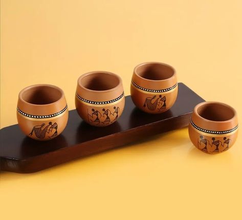 Warli Handpainted Terracotta Clay Kullad Tea Cups Set & Coffee Kullad Cups Chai Kulhads Cup Set (220 ML, Set of 4, Brown) . . Notes: a) Comes in a set of 4. b) Tray shown in the image is not included with this set. c) As this product is handcrafted there might be a slight color or design variation, which is natural and hence makes the product unique. #naturelovers #startup #startupbusiness #business #tea #goodmorning #good #mood #creativeliving #unique #warli #warliart #savewarli #notsosmall... Painted Pots Diy, Pottery Painting Designs, Terracotta Clay, Cups Set, Pot Designs, Painted Pots, Old World Charm, Tea Cup Set, Pottery Painting