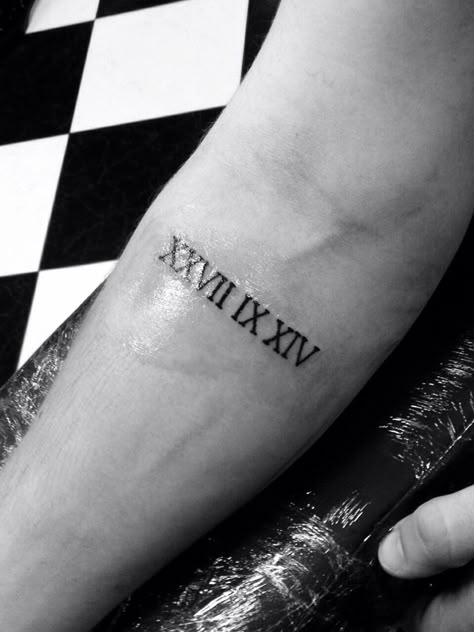 XXVII IX XIV Roman numerals tattoo Roman Numeral Wrist Tattoos Men, Forearm Tattoo Men Roman Numeral, Roman Numbers Tattoo Forearm, Men Tattoo Roman Numerals, Date Tattoo On Forearm, Xxvii Number Tattoo, Roman Script Tattoo, Male Roman Numeral Tattoo, Roman Numerals Tattoo Forearm