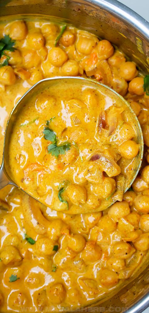 Creamy Coconut Chickpea Curry Recipe - lightly spiced prepared with coconut milk, this vibrant and wholesome curry is sure to make you feel amazing. This is a one pot vegan dinner meal idea inspired by Indian curries. www.MasalaHerb.com Chickpea Coconut Curry Soup, Coconut Chickpea Curry Crockpot, Beans And Coconut Milk, Coconut Bean Curry, Yellow Chickpea Curry, Coconut Curry With Chickpeas, Coconut Milk Chickpea Curry, Chickpea Indian Curry, Chickpea Korma Curry