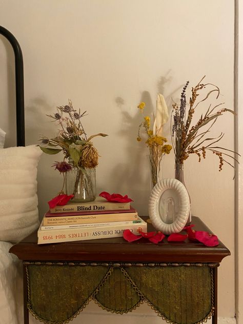 bedside table, vintage, flowers, dried flowers, books, rose petals, picture frames, white, clean aesthetic, room decor, decor ideas, vintage aesthetic, coquette, coquette room Vintage Bedside Table Ideas, Clean Aesthetic Room, White Clean Aesthetic, Aesthetic Bedside Table, Picture Frames White, Vintage Bedside Table, Coquette Room, Flowers Dried, Clean Aesthetic